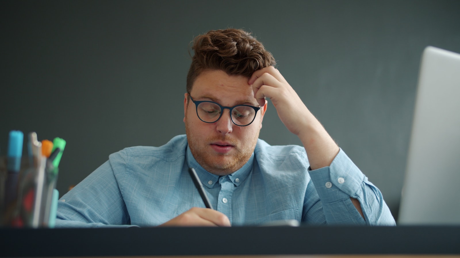 Business owner puzzled while reviewing financial numbers